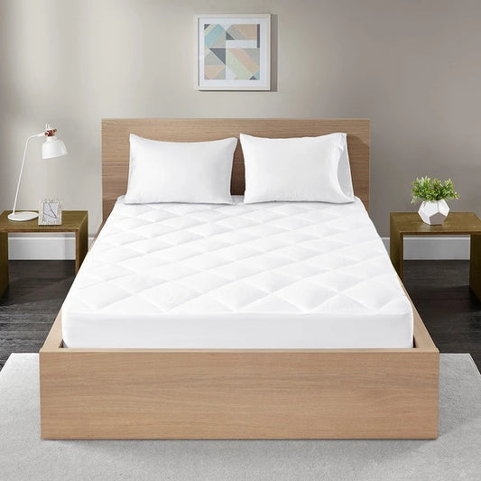 Cotton percale quilted mattress pad fitted on a mattress for breathable comfort